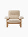 Front view of the Brasilia Lounge Chair. It has a high back, natural oak frame, and thick, comfortable sheepskin upholstery.