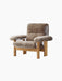 Front-angle view of the Brasilia Lounge Chair with a high back, upholstered in brown sheepskin with a natural oak frame.