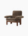 Angled view of the Brasilia Lounge Chair with a walnut frame and plush, deep brown Root sheepskin upholstery.