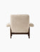 Back view of the Brasilia Lounge Chair, High Back, upholstered in cream sheepskin with a contrasting dark stained oak frame.