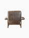 Rear view of the Brasilia Lounge Chair, High Back, in brown sheepskin with a dark walnut frame on a black background.