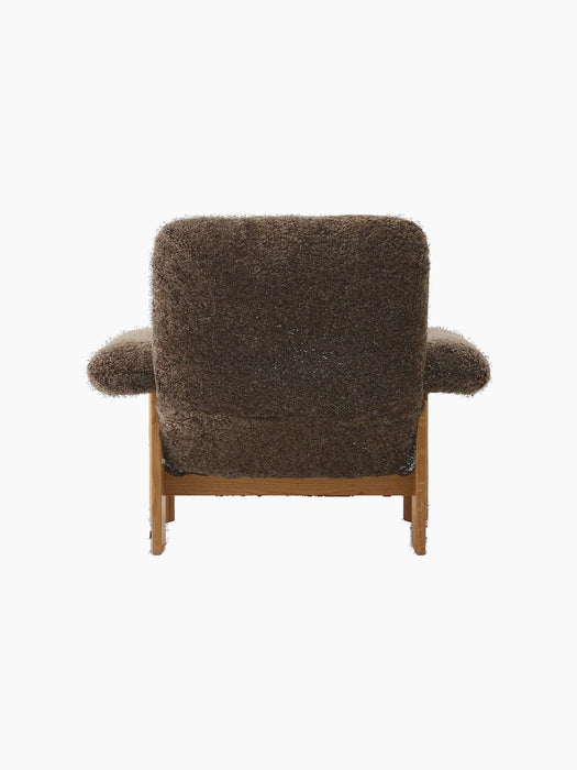 Rear view of the Brasilia Lounge Chair, High Back. Upholstered in dark brown Root Sheepskin with a solid natural oak frame.