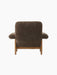Rear view of the Brasilia Lounge Chair, High Back. Upholstered in dark brown Root Sheepskin with a solid natural oak frame.