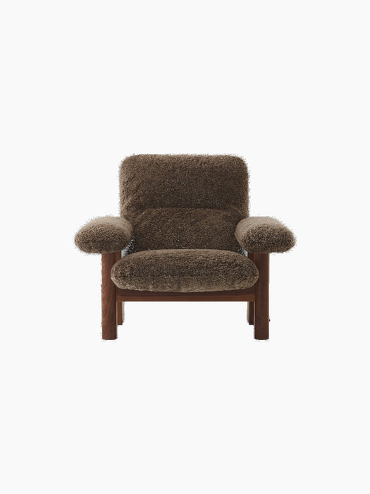 Front view of the Brasilia Lounge Chair, High Back, with a dark stained oak frame and plush, brown Sheepskin Root upholstery.