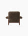 Rear view of the Brasilia Lounge Chair, High Back, upholstered in dark Root sheepskin with a solid walnut frame.