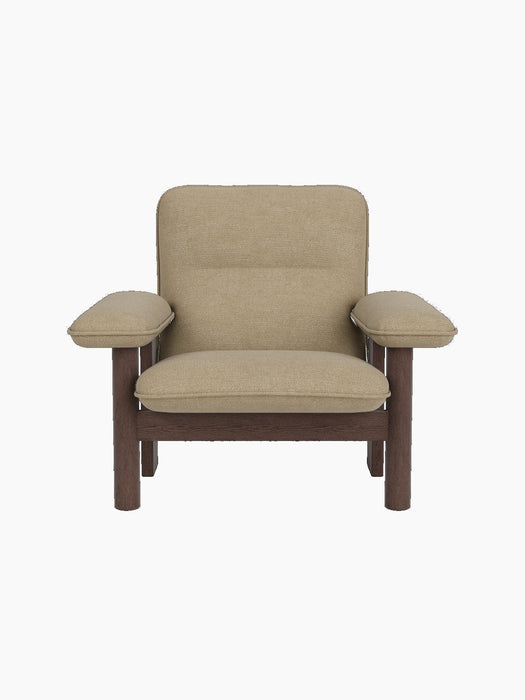 Front-on view of the Brasilia Lounge Chair, High Back, with a dark stained oak frame and cushions in a sand bouclé.