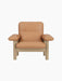 Brasilia Lounge Chair in natural oak and camel leather. A minimalist modern armchair with a sturdy frame and plush cushions.