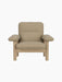 Front view of the Brasilia Lounge Chair with a natural oak frame and thick cushions upholstered in Audo Bouclé 02.