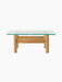 Front view of the Brasilia Lounge Table in natural oak. A rectangular glass top sits on a stout wooden base with chunky legs.