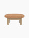 Side view of the Brasilia Ottoman with a camel leather cushion and a natural oak frame with four robust, cylindrical legs.