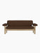 A front-on view of the Brasilia Sofa with a natural oak frame, exaggerated armrests and brown Audo Bouclé 07 upholstery.