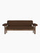 A front view of the Brasilia Sofa with a solid walnut frame and brown Audo Bouclé 07 upholstery against a black background.