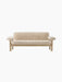 Front view of the Brasilia Sofa upholstered in light-coloured sheepskin, with a solid natural oak frame and rounded armrests.