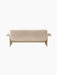Back view of the Brasilia Sofa in Sheepskin, showing its low back, plush light-coloured upholstery and natural oak frame.