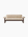 Front view of the Brasilia Sofa, Sheepskin. Features a dark wood frame and plush, off-white sheepskin upholstery.