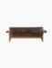 Back view of the Brasilia Sofa, upholstered in plush brown sheepskin with a visible light oak frame and rounded armrests.