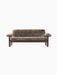 Front view of the Brasilia Sofa. Upholstered in brown sheepskin with a dark wood frame, low back, and rounded armrests.