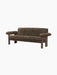 Brasilia Sofa upholstered in dark brown sheepskin, featuring a dark stained wood frame with rounded legs and large armrests.