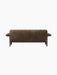 Back view of the Brasilia Sofa, upholstered in textured brown sheepskin, showing its low back and dark wood frame.