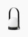 The black Carrie Table Lamp, Portable shown from an angle. It has a white glass orb, a circular base and a matching handle.