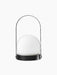 The black Carrie Portable Table Lamp shown from the front, with a basket-like base, a white glass orb, and a slender handle.