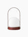 Front view of the Carrie Table Lamp, Portable, in Burned Red. It features a white glass shade on a red base and handle.