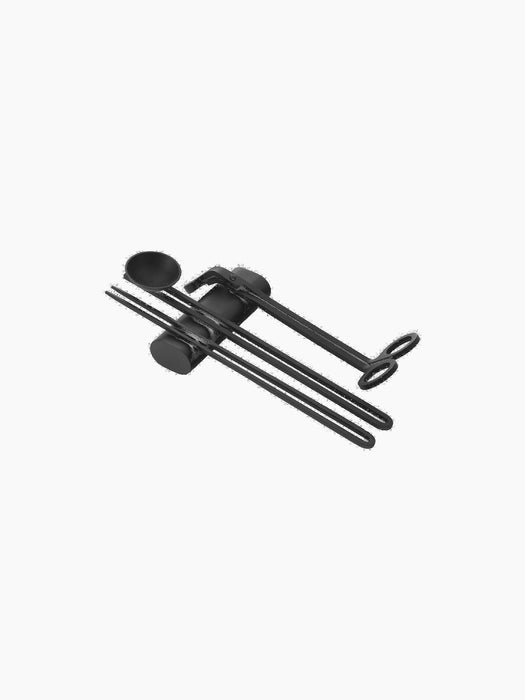 A complete Clip Candle Care Kit in matte black, with a wick trimmer, snuffer, and dipper held together by a central clip.
