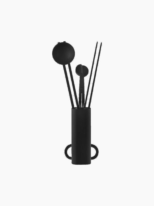 A black Clip Candle Care Kit with a cylindrical holder containing a candle snuffer, a wick trimmer, and a wick dipper.