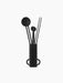 A black Clip Candle Care Kit with a cylindrical holder containing a candle snuffer, a wick trimmer, and a wick dipper.