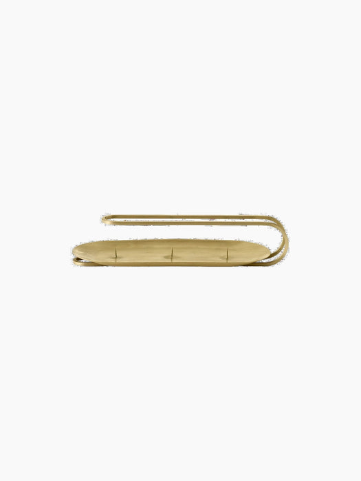 Front view of the brass Clip Candle Holder, a 3-arm design with an oval base and a curved handle, against a black background.