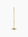 Front view of the Clip Candle Holder in brushed brass, a tall, minimalist design with a long looped stem and a circular base.