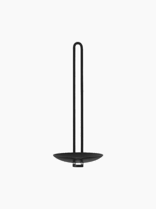 Front view of the black Clip Wall Candle Holder. Minimalist, with a circular base and a tall, slim, U-shaped handle.