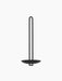 Front view of the black Clip Wall Candle Holder. Minimalist, with a circular base and a tall, slim, U-shaped handle.