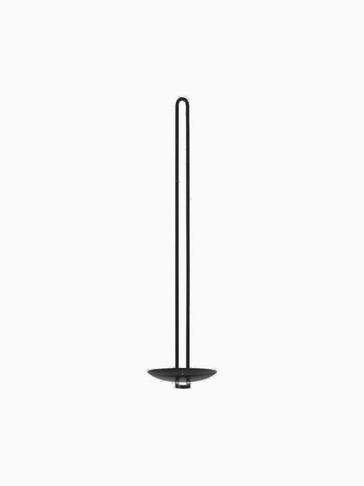 Front view of the tall, minimalist Clip Wall Candle Holder in black, featuring a long dual stem and a round textured base.