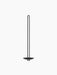 Front view of the tall, minimalist Clip Wall Candle Holder in black, featuring a long dual stem and a round textured base.
