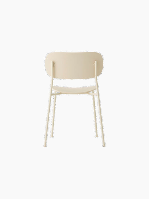 Rear view of the ivory Co Dining Chair, Outdoor, with its minimalist recycled plastic backrest and slim steel frame.