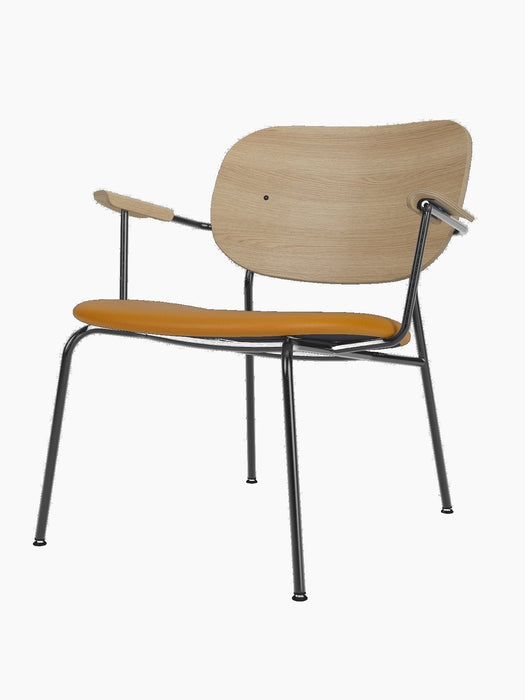 Co Lounge Chair with natural oak veneer backrest and armrests, tan Dakar leather upholstered seat, and black steel frame.