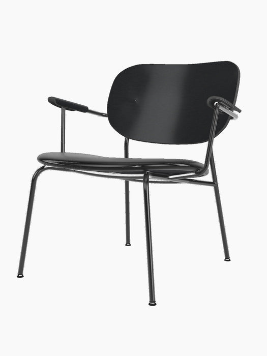 A Co Lounge Chair with a black upholstered seat, black-painted oak backrest, and a slender black powder-coated steel frame.