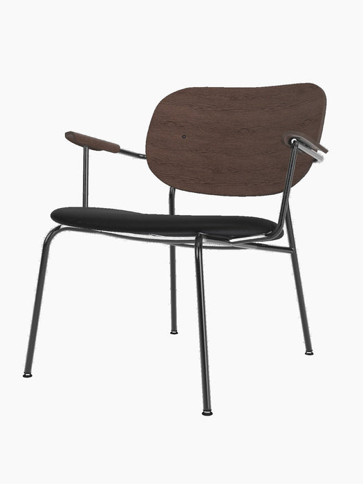 Co Lounge Chair with a padded black leather seat, curved dark stained oak backrest, and slender black metal frame.