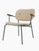 Co Lounge Chair, fully upholstered in light brown Moss fabric, with dark stained oak armrests and a black metal frame.