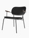 Co Lounge Chair with a slender black metal frame, black leather upholstery, and dark stained oak armrests.