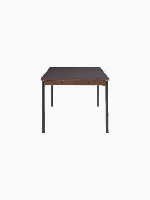 A side profile of the rectangular Co Table with dark terra laminate top, a solid oak trim apron, and thin black steel legs.
