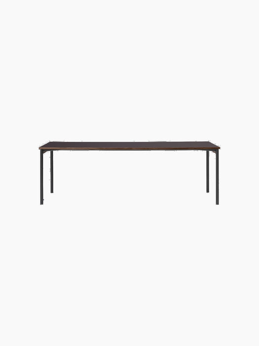 A front-on view of the rectangular Co Table with a dark Terra Laminate top, an oak edge and a sleek black steel frame.