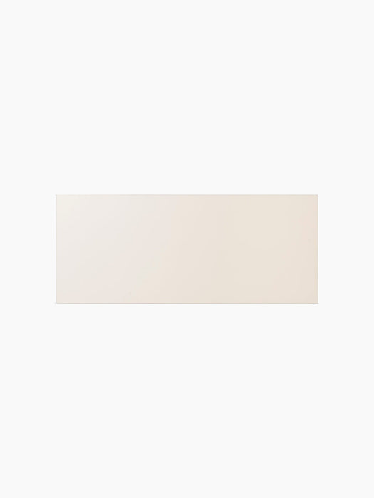 Top-down view of the rectangular Co Table, showcasing the smooth surface of the creme laminate tabletop.