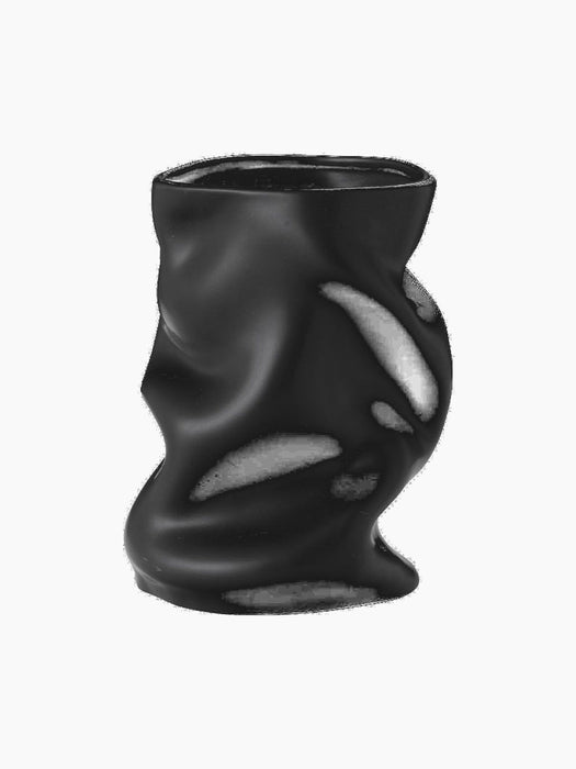 Front view of the Collapse Vase 20 in black. The sculptural ceramic vase has a smooth matte finish and a collapsed form.