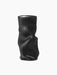 A front-on shot of the black Collapse Vase. The modern, sculptural vase has a matte finish and distinctive crumpled form.