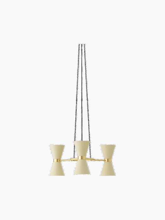 A front view of the Collector Chandelier, 3, featuring three cream, perforated hourglass shades on a polished brass frame.