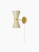Side view of the Collector Wall Lamp with a cream-coloured hourglass shade, polished brass band, and matching wall mount.