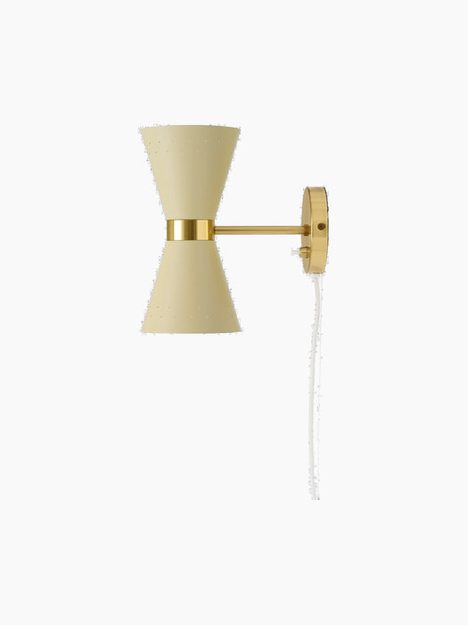 A side profile of the Collector Wall Lamp, featuring a cream hourglass shade with perforated details and brass fittings.