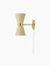 A side profile of the Collector Wall Lamp, featuring a cream hourglass shade with perforated details and brass fittings.